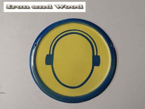 Oud emaille rond geel donkerblauw bord koptelefoon/gehoorbescherming